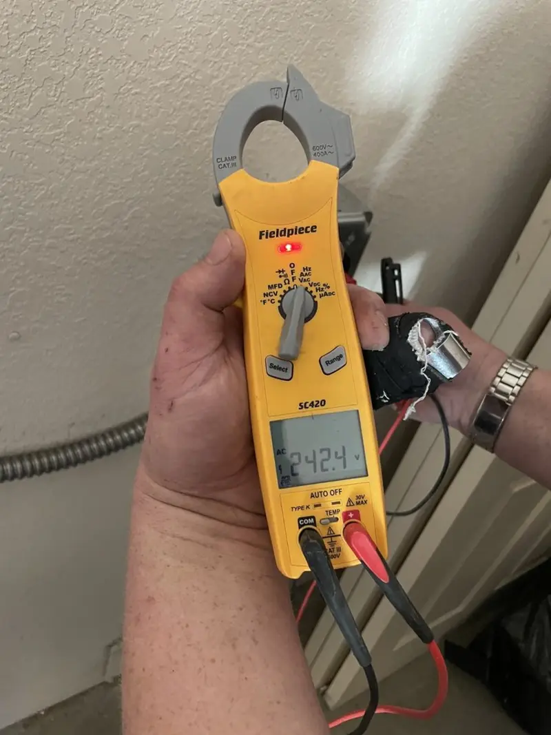 Voltage testing with clamp meter during Circuit Breaker Repair in Highland Park
